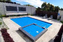 WaterMark solar pool cover on pool and spa